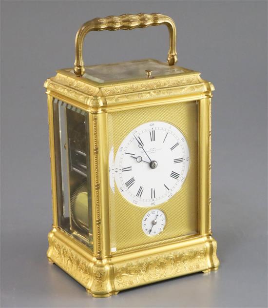 A late 19th century French ormolu quarter repeating carriage alarum clock, 5.75in., with leather travelling case